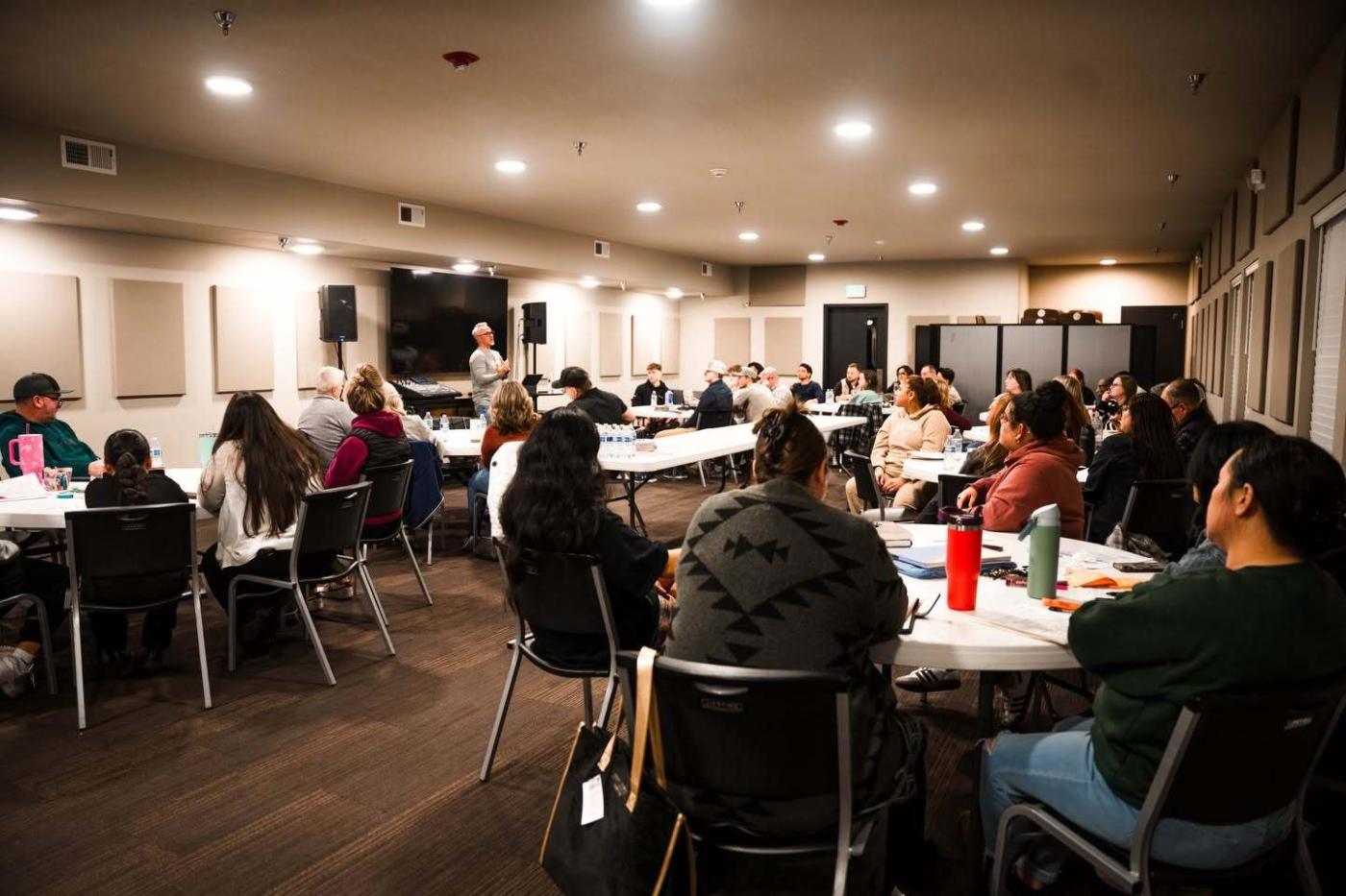 Leaders in a small-group leadership session