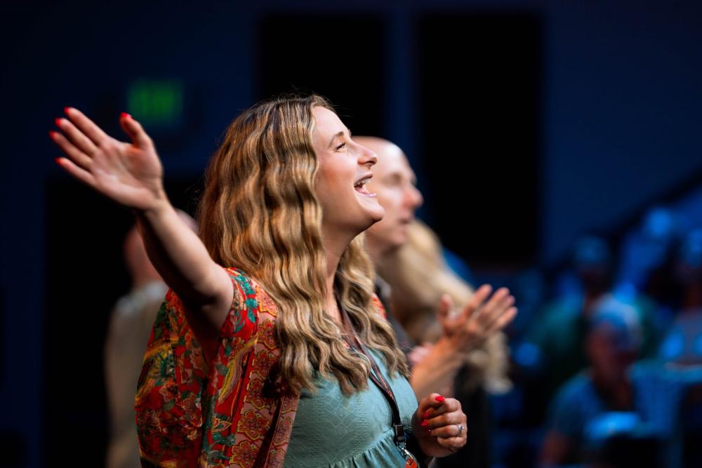 Woman worshiping with raised hand